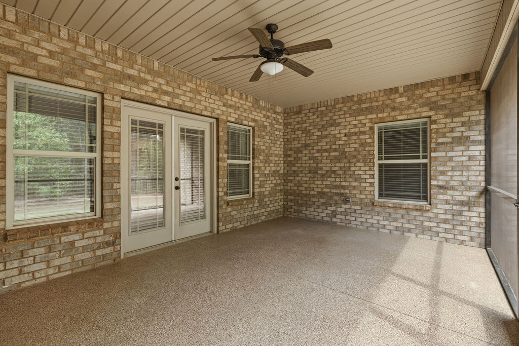 214 Friend Street Anderson, SC 29621 - Photo 33 of 40 This spacious outdoor area features durable brick walls and a practical ceiling fan.