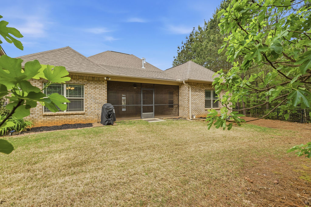 214 Friend Street Anderson, SC 29621 - Photo 36 of 40 This residence features a well-maintained yard and a comfortable screened porch.