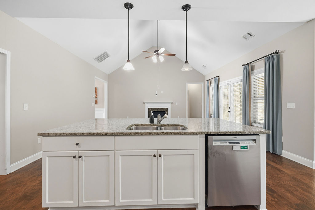 214 Friend Street Anderson, SC 29621 - Photo 10 of 40 This spacious kitchen with an inviting island and elegant finishes offers comfortable living.