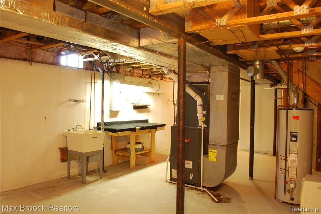 1338 Chestnut Circle Rochester, MI 48309 - Photo 65 of 69 unfinished area of basement with mechanics and plenty of storage
