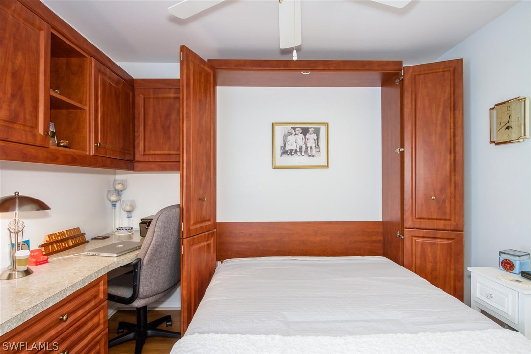 17436 Fuchsia Road Fort Myers, FL 33967 - Photo 24 of 25 a bedroom with a bed and wooden floor
