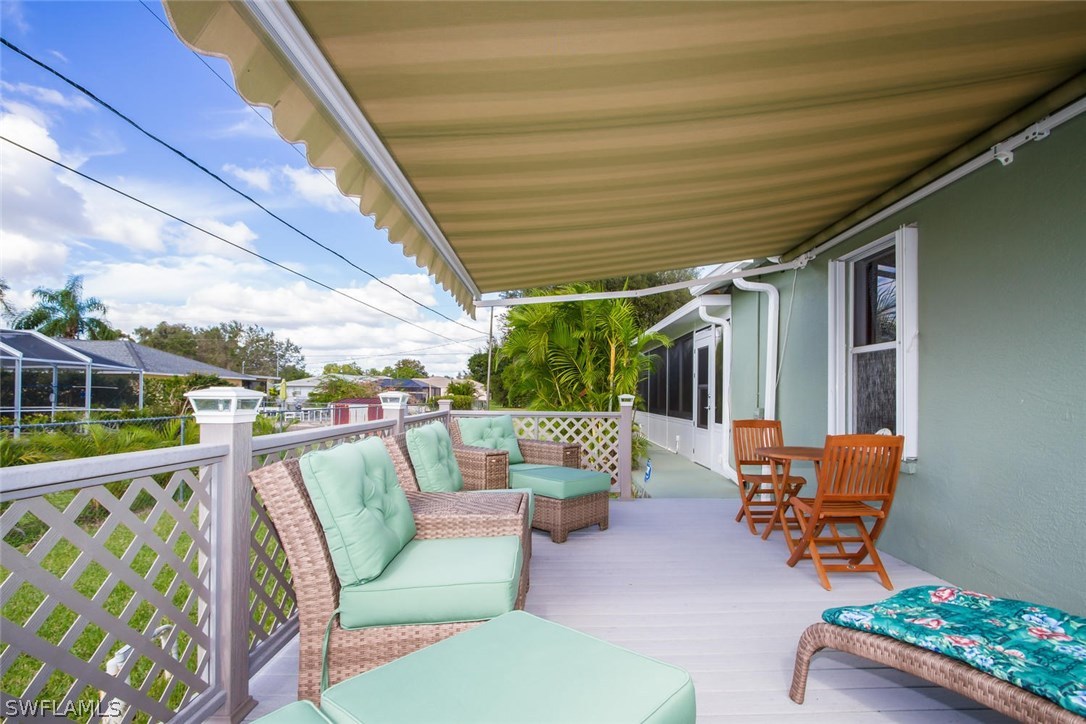 17436 Fuchsia Road Fort Myers, FL 33967 - Photo 4 of 25 a balcony with chairs and a table
