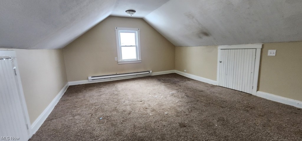 3599 Grosvenor Road Cleveland, OH 44118 - Photo 20 of 25 Bonus room with carpet floors and a baseboard radiator