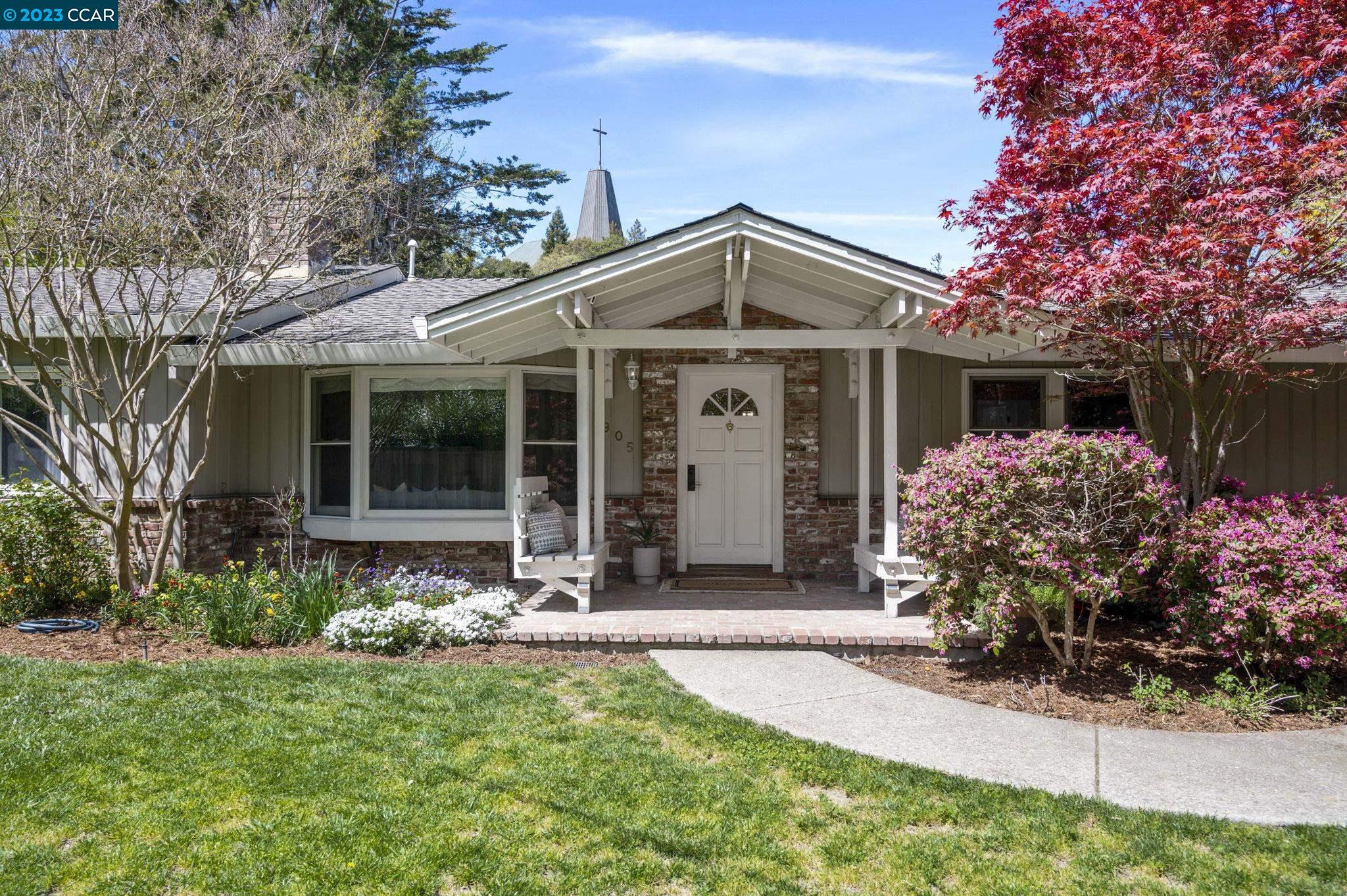 a front view of a house with garden