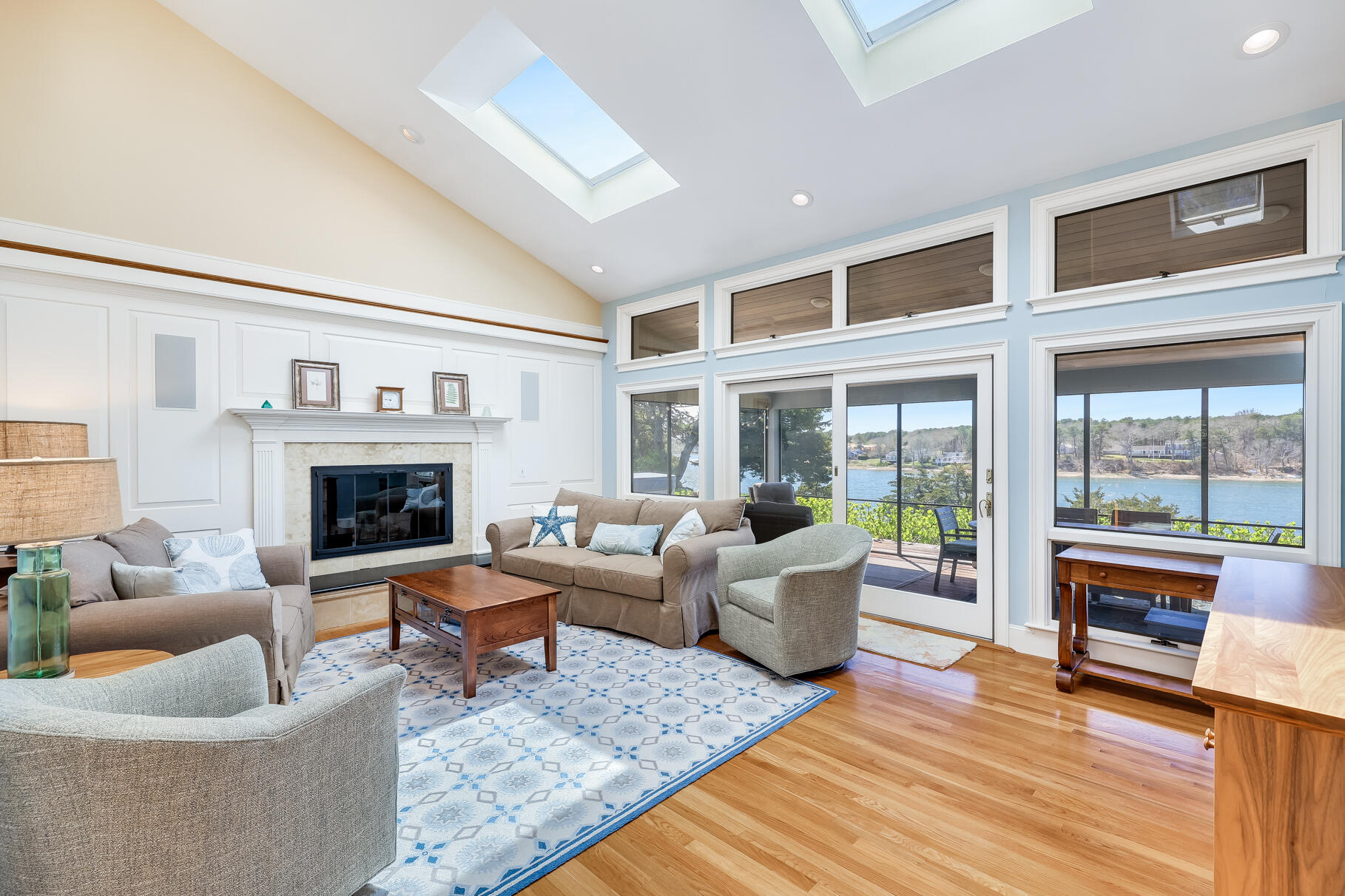 34 Jack Knife Point Road Orleans, MA 02653 - Photo 12 of 56 a living room with furniture and a fireplace