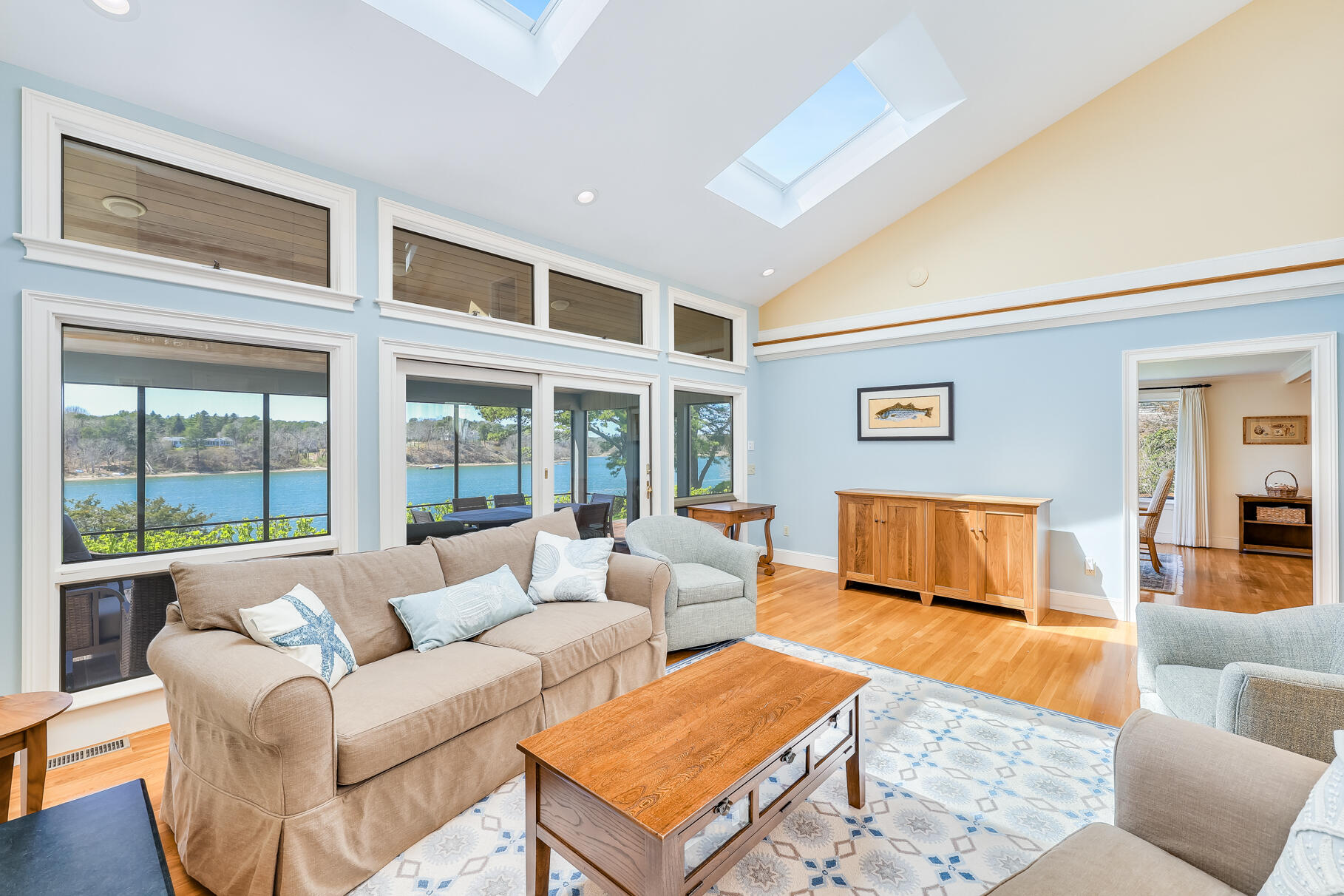34 Jack Knife Point Road Orleans, MA 02653 - Photo 13 of 56 a living room with furniture a large window and a rug