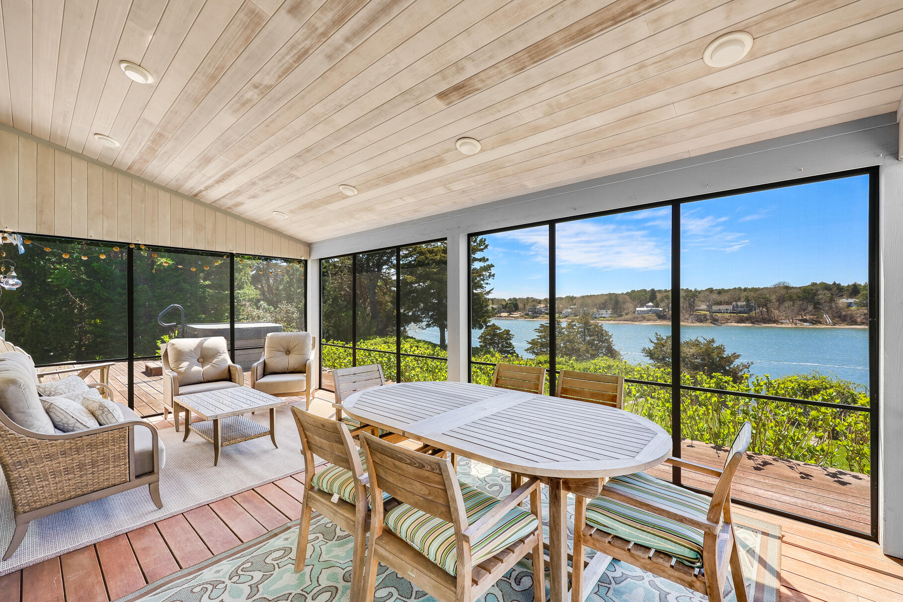 34 Jack Knife Point Road Orleans, MA 02653 - Photo 15 of 56 a view of a dining room with furniture window and outside view