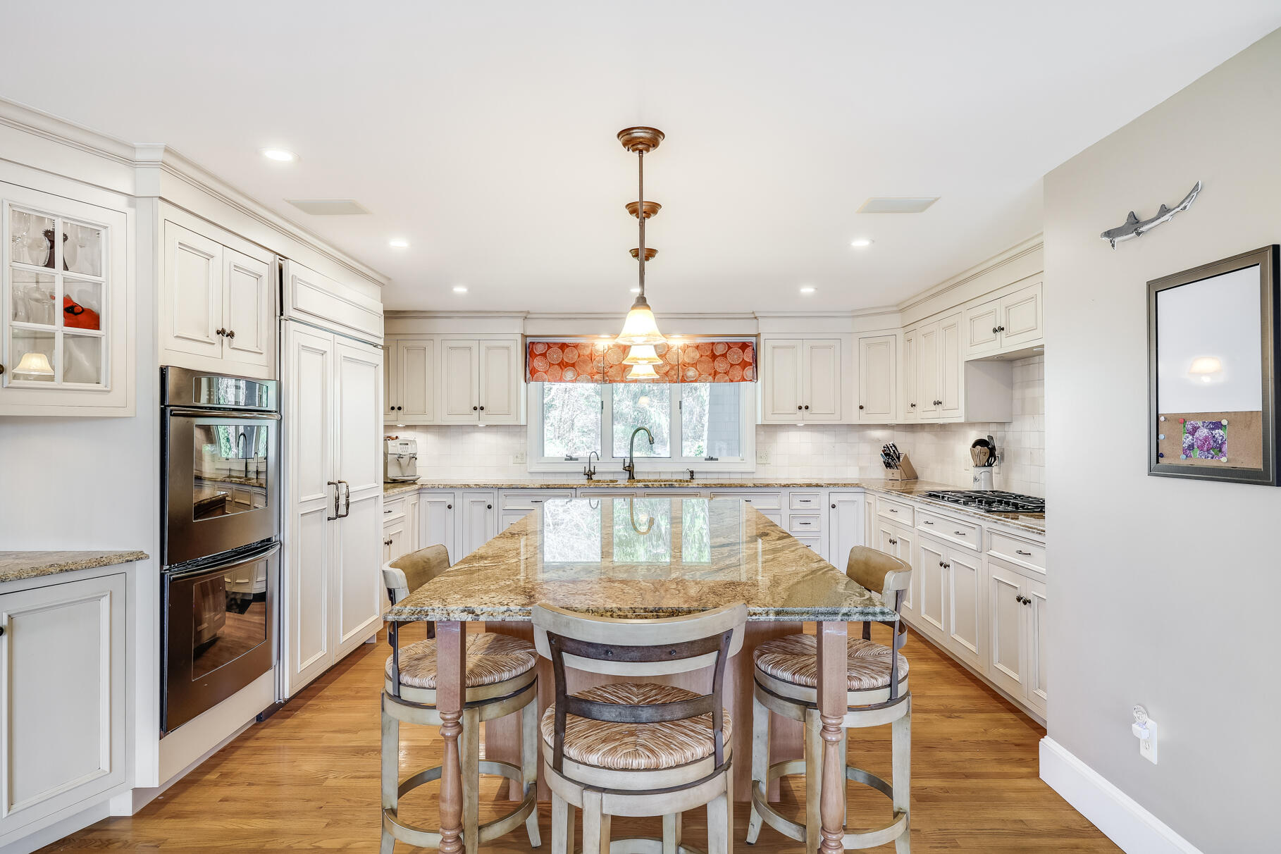 34 Jack Knife Point Road Orleans, MA 02653 - Photo 17 of 56 a kitchen with granite countertop white cabinets and stainless steel appliances