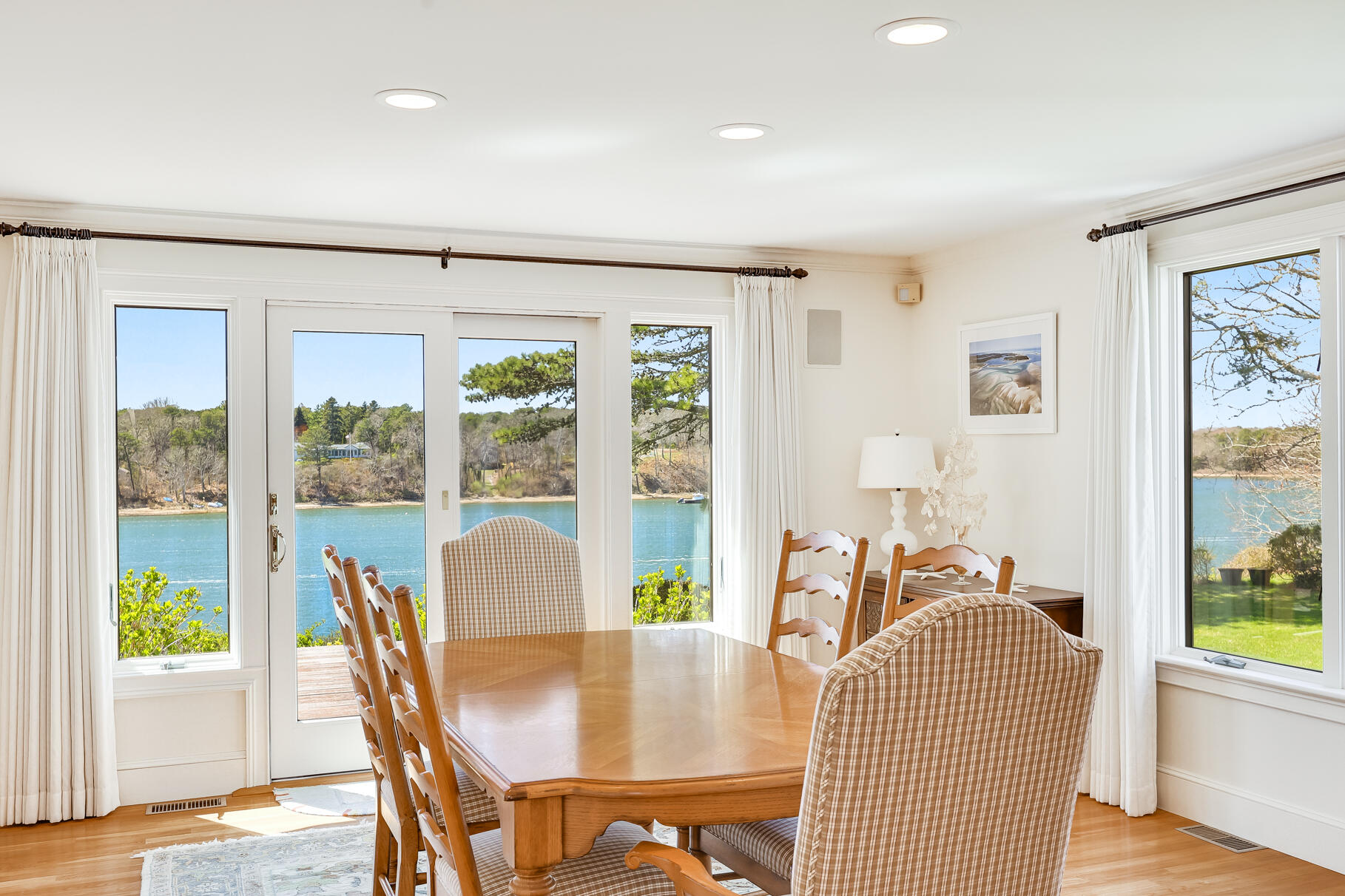 34 Jack Knife Point Road Orleans, MA 02653 - Photo 21 of 56 a view of a dining room with furniture window and wooden floor