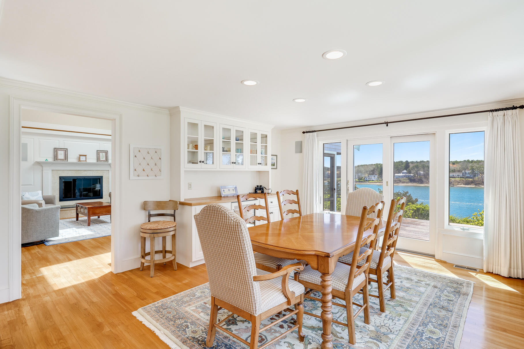 34 Jack Knife Point Road Orleans, MA 02653 - Photo 22 of 56 a view of a dining room with furniture wooden floor and a rug