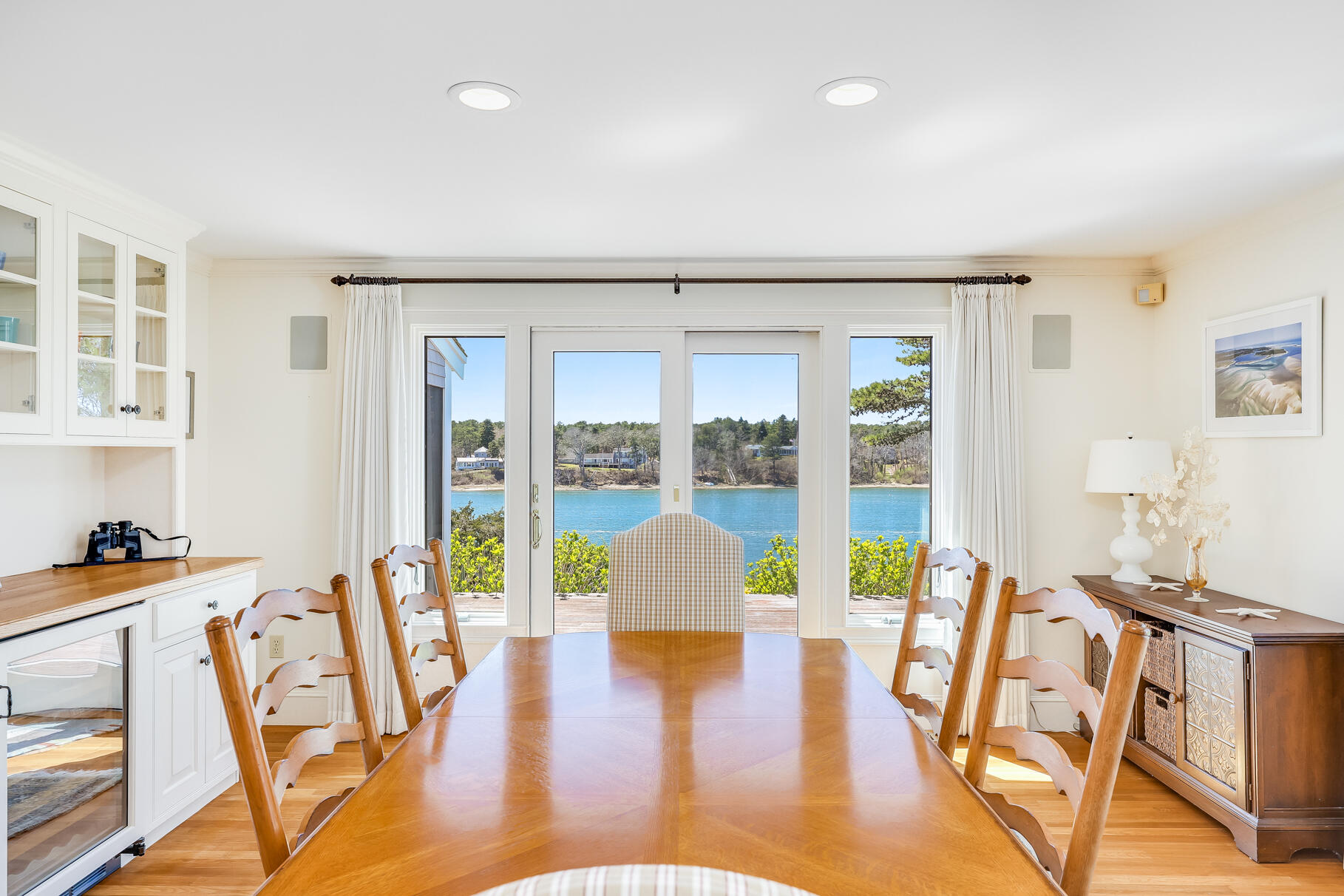 34 Jack Knife Point Road Orleans, MA 02653 - Photo 23 of 56 a view of a dining room with furniture window and wooden floor