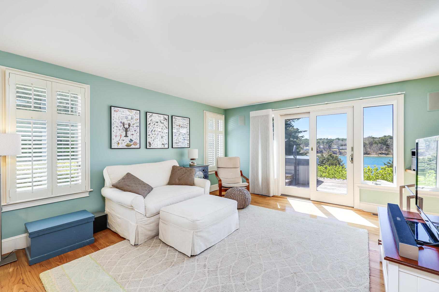 34 Jack Knife Point Road Orleans, MA 02653 - Photo 24 of 56 a living room with furniture and large windows