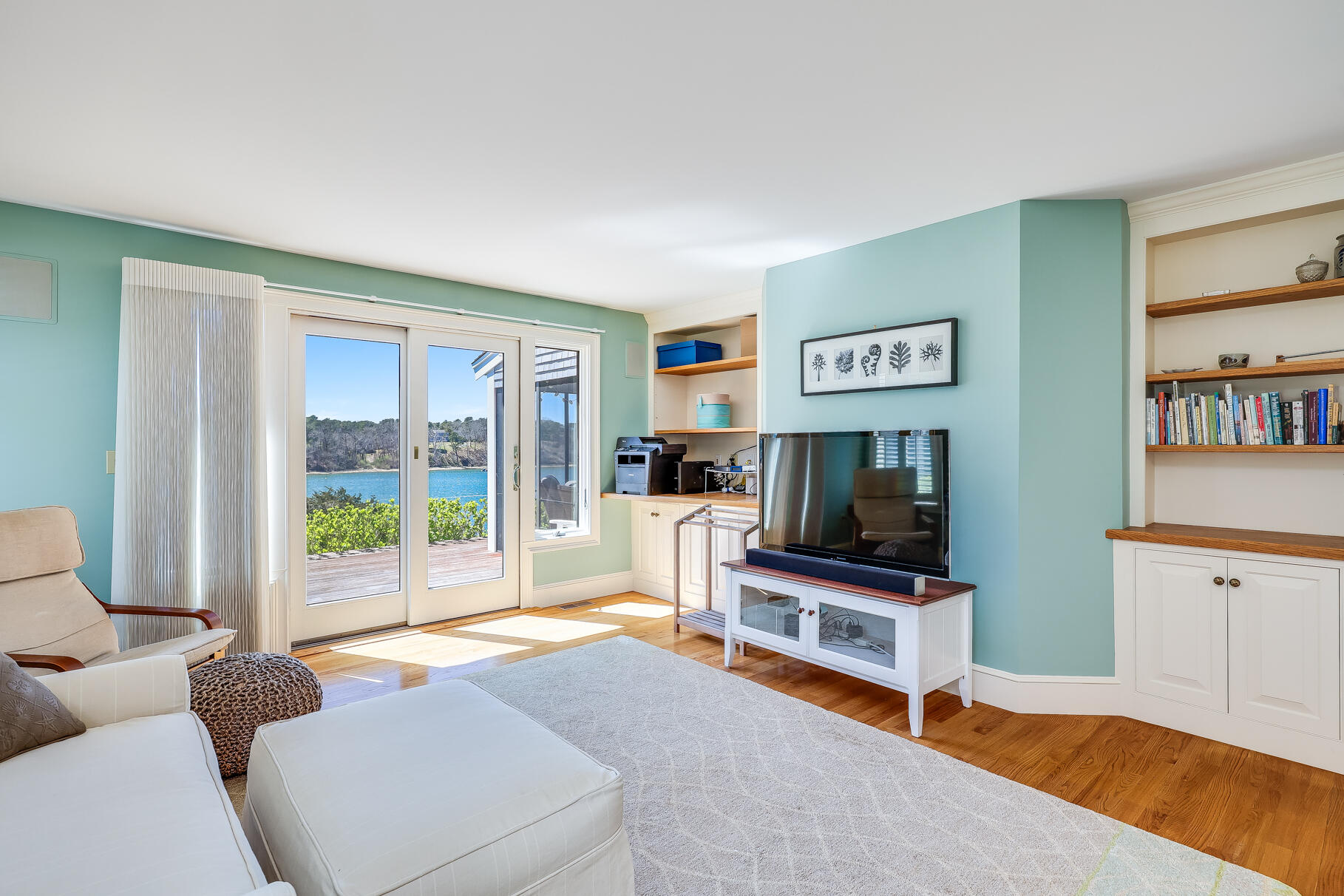 34 Jack Knife Point Road Orleans, MA 02653 - Photo 25 of 56 a living room with furniture and a flat screen tv
