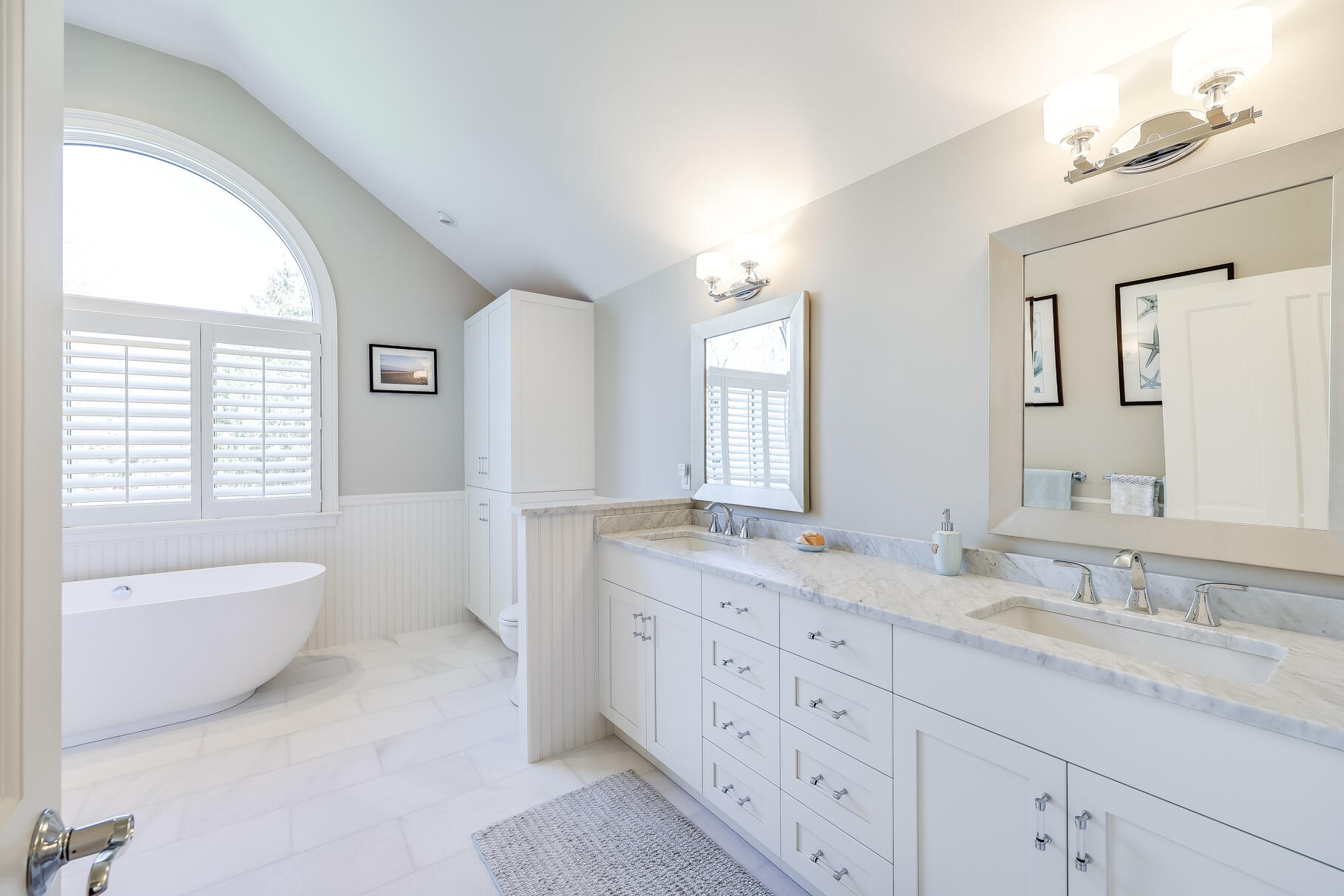 34 Jack Knife Point Road Orleans, MA 02653 - Photo 30 of 56 a spacious bathroom with a granite countertop double vanity sink a mirror and a bathtub