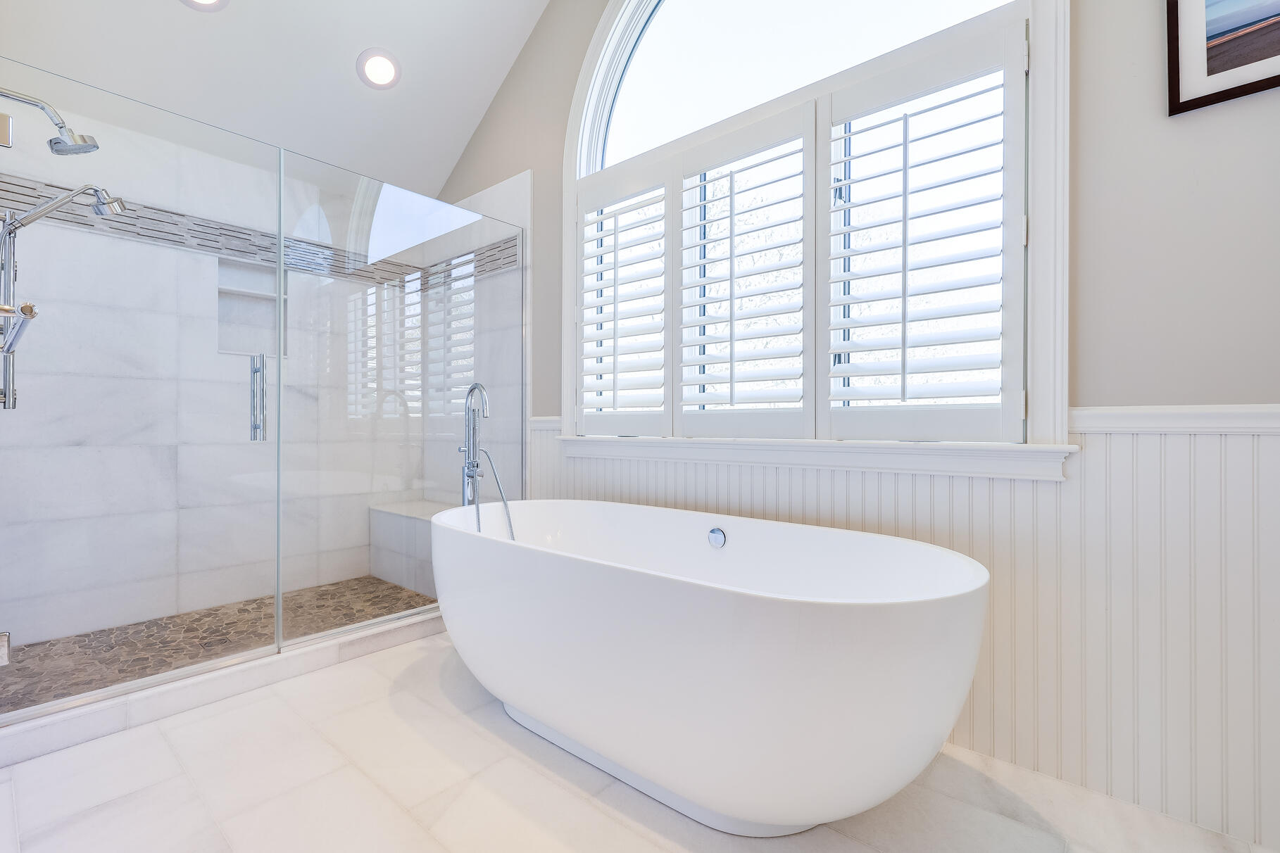 34 Jack Knife Point Road Orleans, MA 02653 - Photo 32 of 56 a white bath tub sitting in a bathroom next to a window