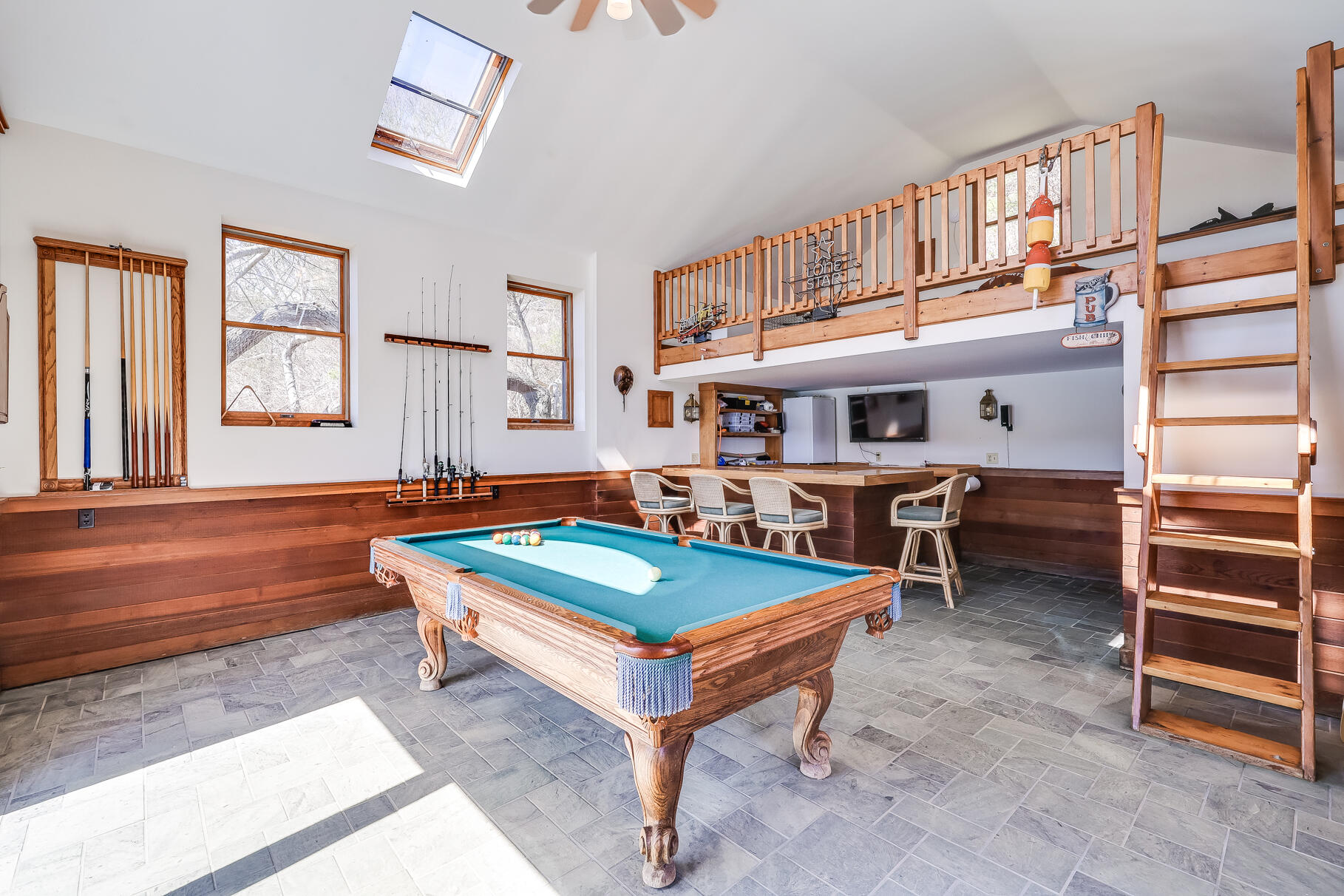 34 Jack Knife Point Road Orleans, MA 02653 - Photo 43 of 56 a living room with furniture a ceiling fan and a window