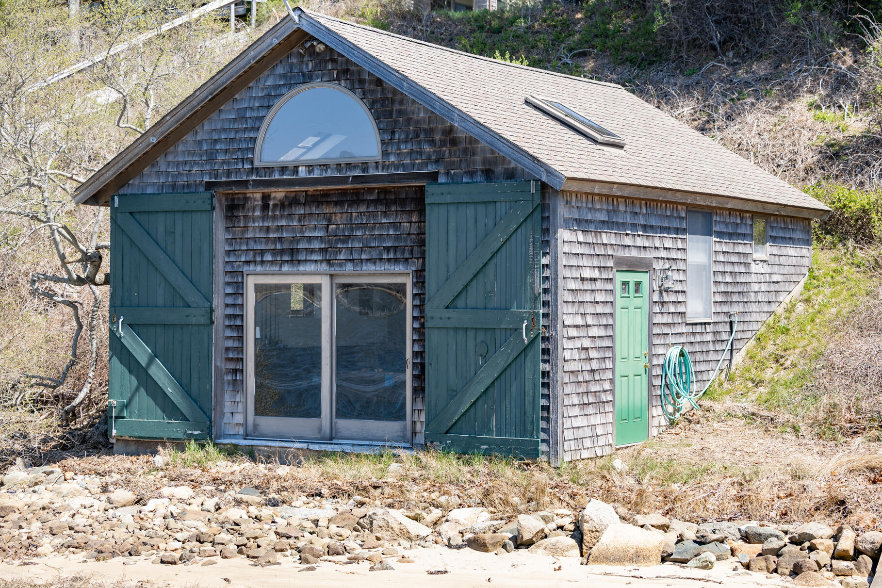 34 Jack Knife Point Road Orleans, MA 02653 - Photo 6 of 56 a front view of a house with a yard