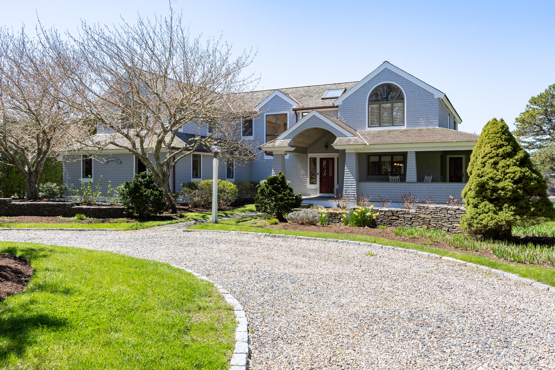 34 Jack Knife Point Road Orleans, MA 02653 - Photo 8 of 56 a front view of a house with garden and porch