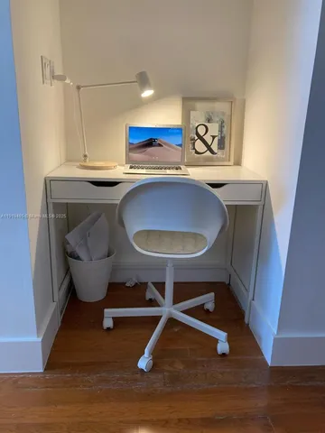 a room with a table chairs and a table