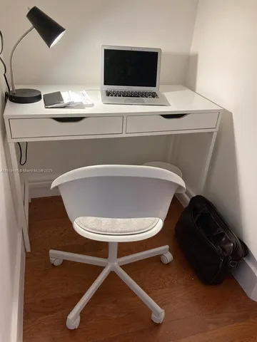a view of a chairs and table in a patio