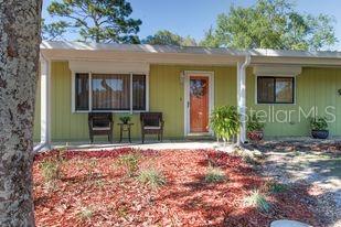 9461 Southwest 101st Place Ocala, FL 34481 - Photo 1 of 1 a front view of a house