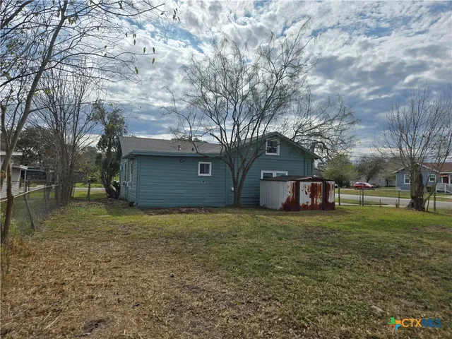 a house with trees in front of it
