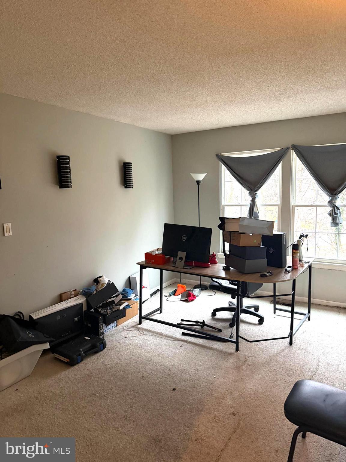 a living room with furniture gym equipment and a view of living room