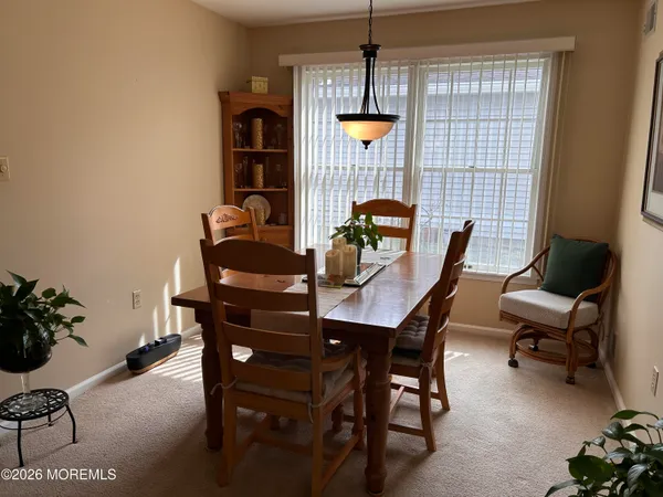 a view of a hallway with seating area