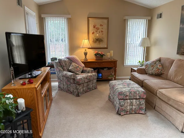 a bedroom with bed and flat screen tv