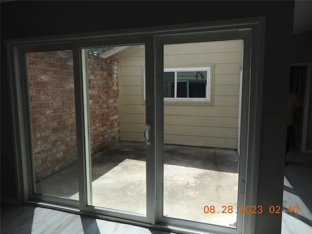 a view of a door and a window