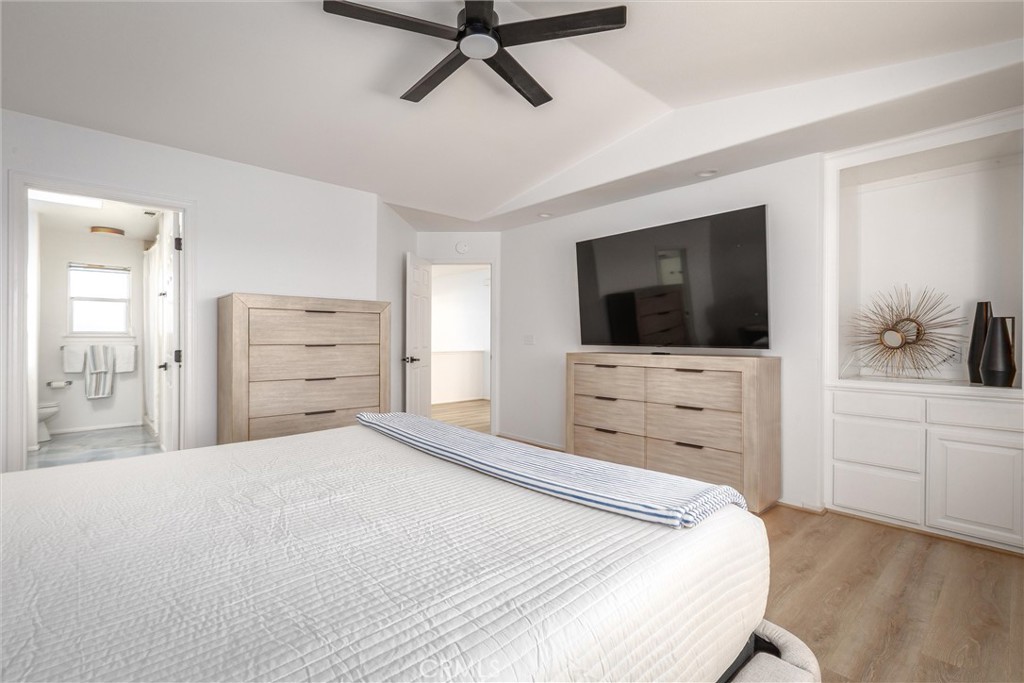 341 North 4th Street Grover Beach, CA 93433 - Photo 15 of 33 a bedroom with a bed and a flat screen tv