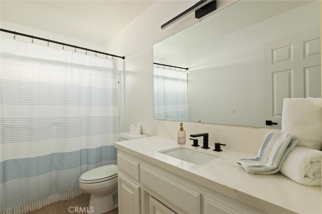 341 North 4th Street Grover Beach, CA 93433 - Photo 19 of 33 a bathroom with a sink and a mirror
