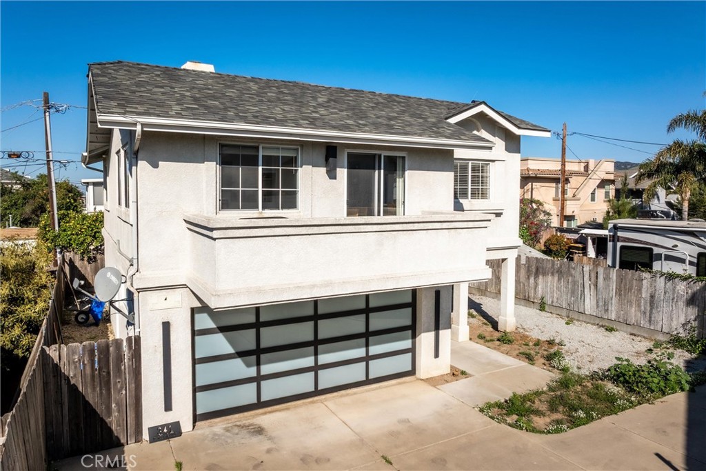 341 North 4th Street Grover Beach, CA 93433 - Photo 27 of 33 a view of a house with a wooden fence