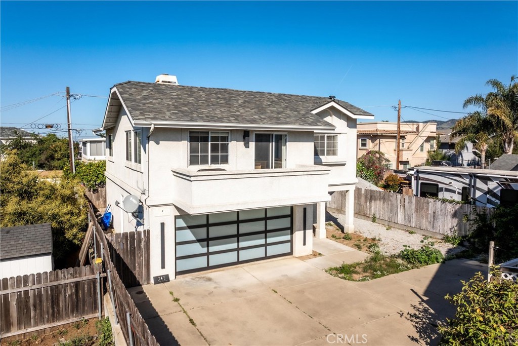 341 North 4th Street Grover Beach, CA 93433 - Photo 29 of 33 a front view of a house with a yard