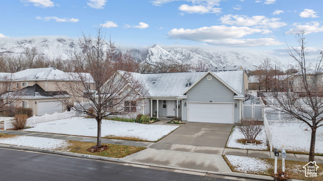 386 North 650 West Springville, UT 84663 - Photo 1 of 1 Ranch-style home featuring an attached garage, concrete driveway, and fence