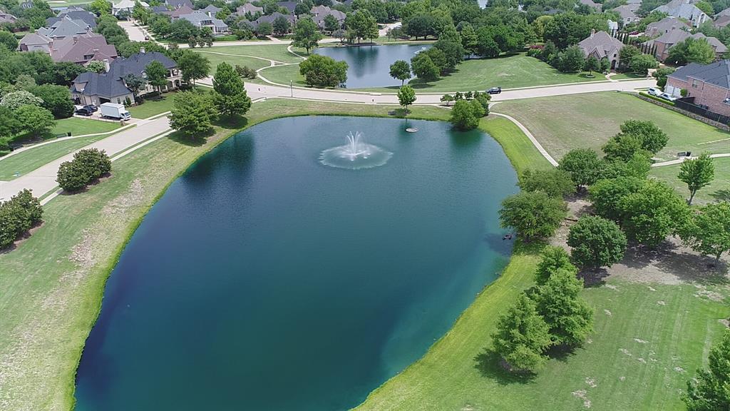 an aerial view of a house with yard