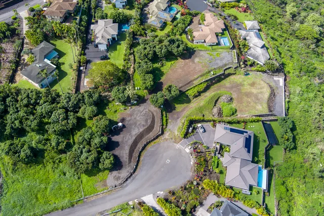 an aerial view of a house with a garden
