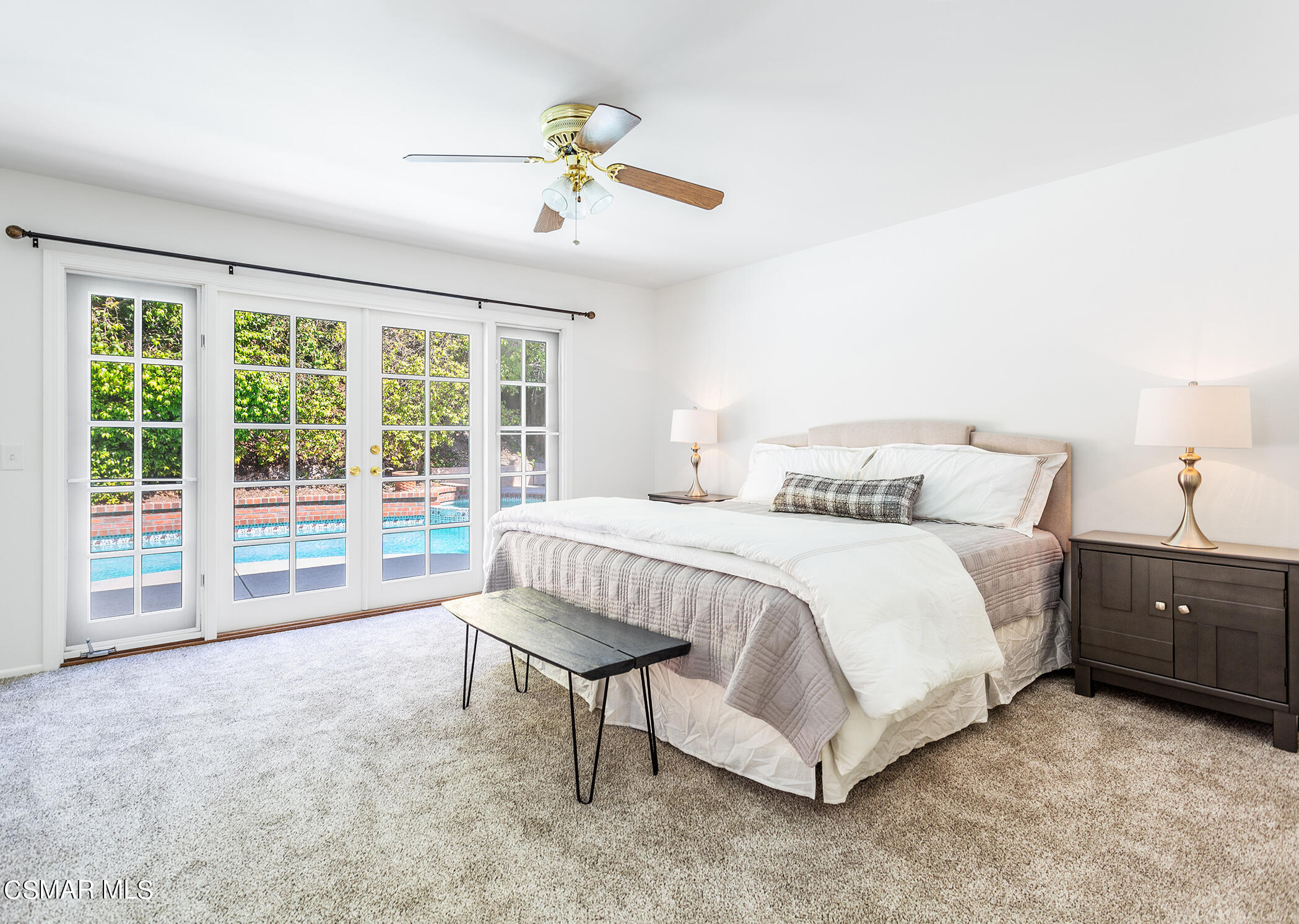 2978 Rikkard Drive Thousand Oaks, CA 91362 - Photo 12 of 21 a spacious bedroom with a bed and a chandelier