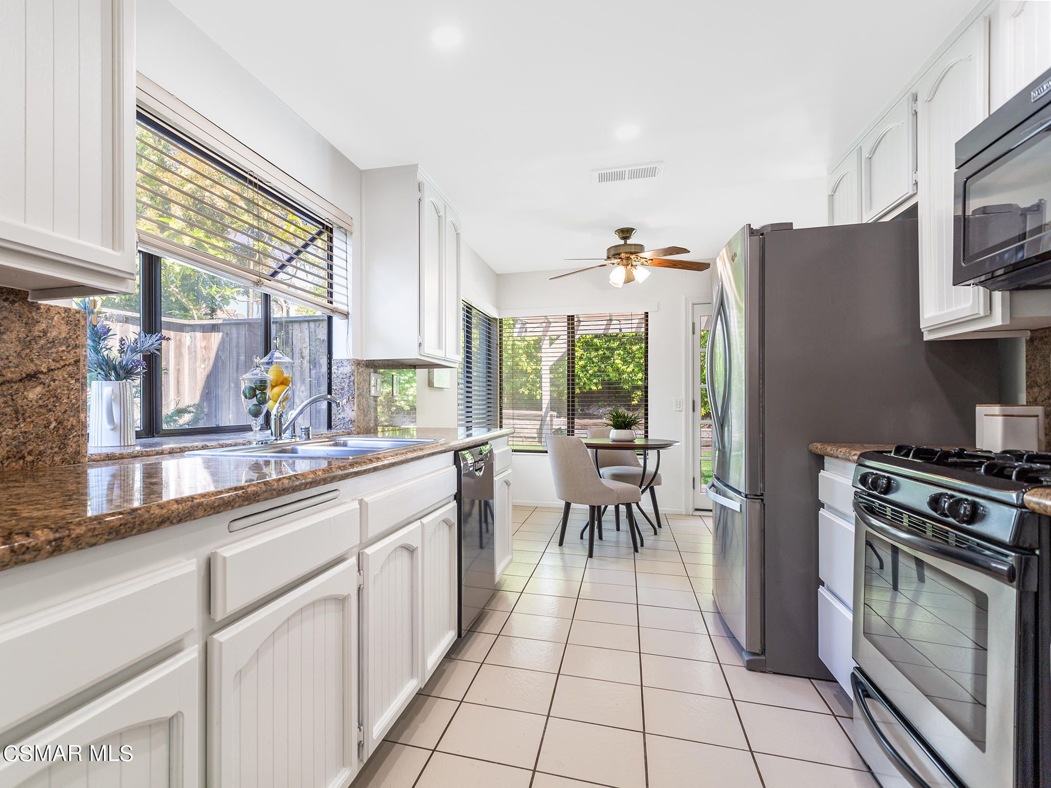 2978 Rikkard Drive Thousand Oaks, CA 91362 - Photo 7 of 21 a kitchen with a sink a counter top space and stainless steel appliances