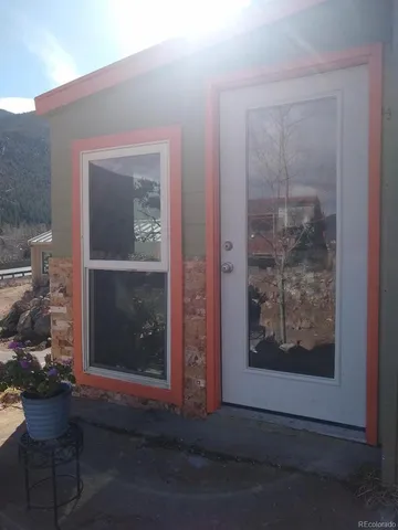 a view of a door and chair in the room