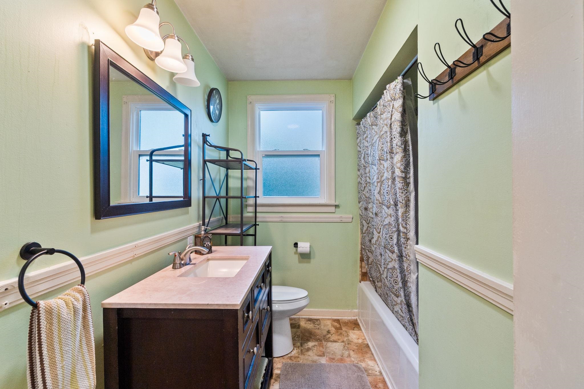 355 Jackson Street Red Bluff, CA 96080 - Photo 11 of 24 a bathroom with a sink a toilet and mirror
