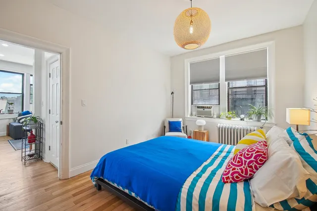 a bedroom with a bed and a table