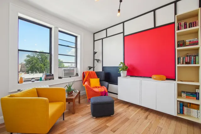a living room with furniture and a window
