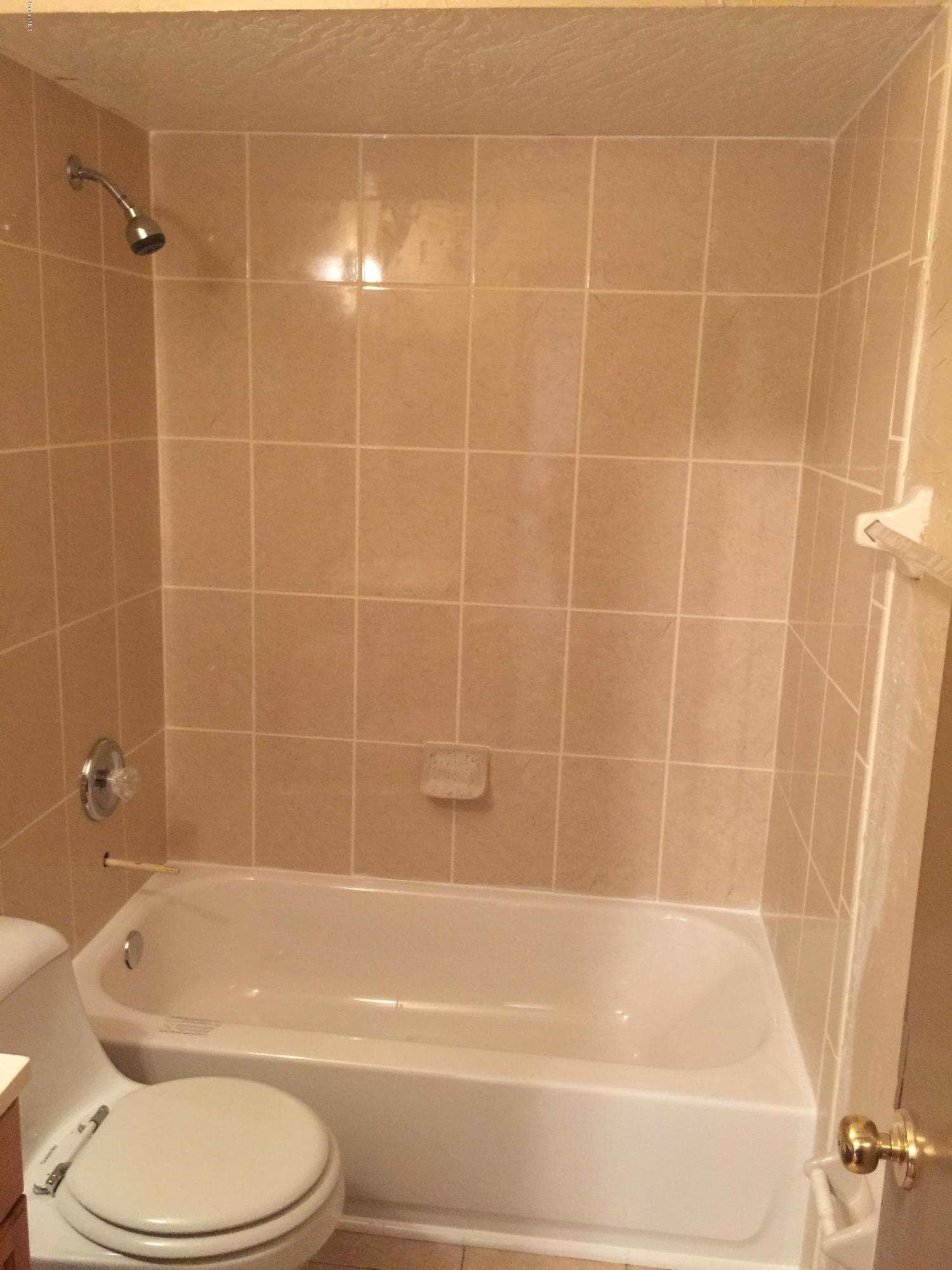 232 Tipton Road Southwest Palm Bay, FL 32908 - Photo 12 of 21 BOTH TUBS & SHOWER TILE ARE NEW