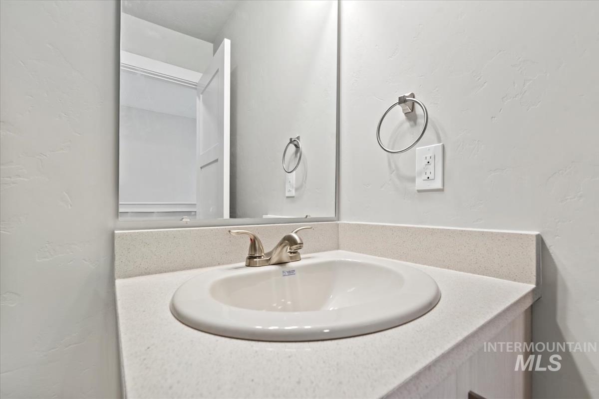 2791 West Palouse Street Boise, ID 83705 - Photo 13 of 26 Bathroom with a textured wall and vanity