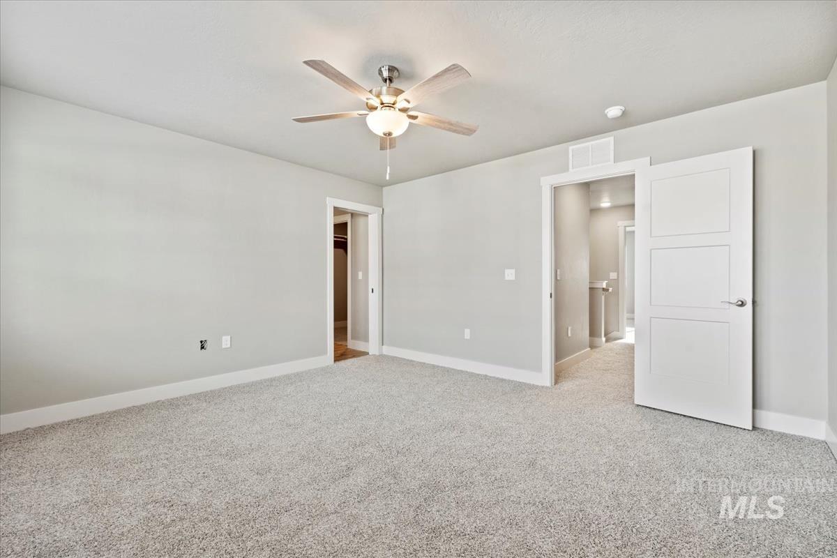 2791 West Palouse Street Boise, ID 83705 - Photo 24 of 26 Unfurnished room with light carpet and ceiling fan