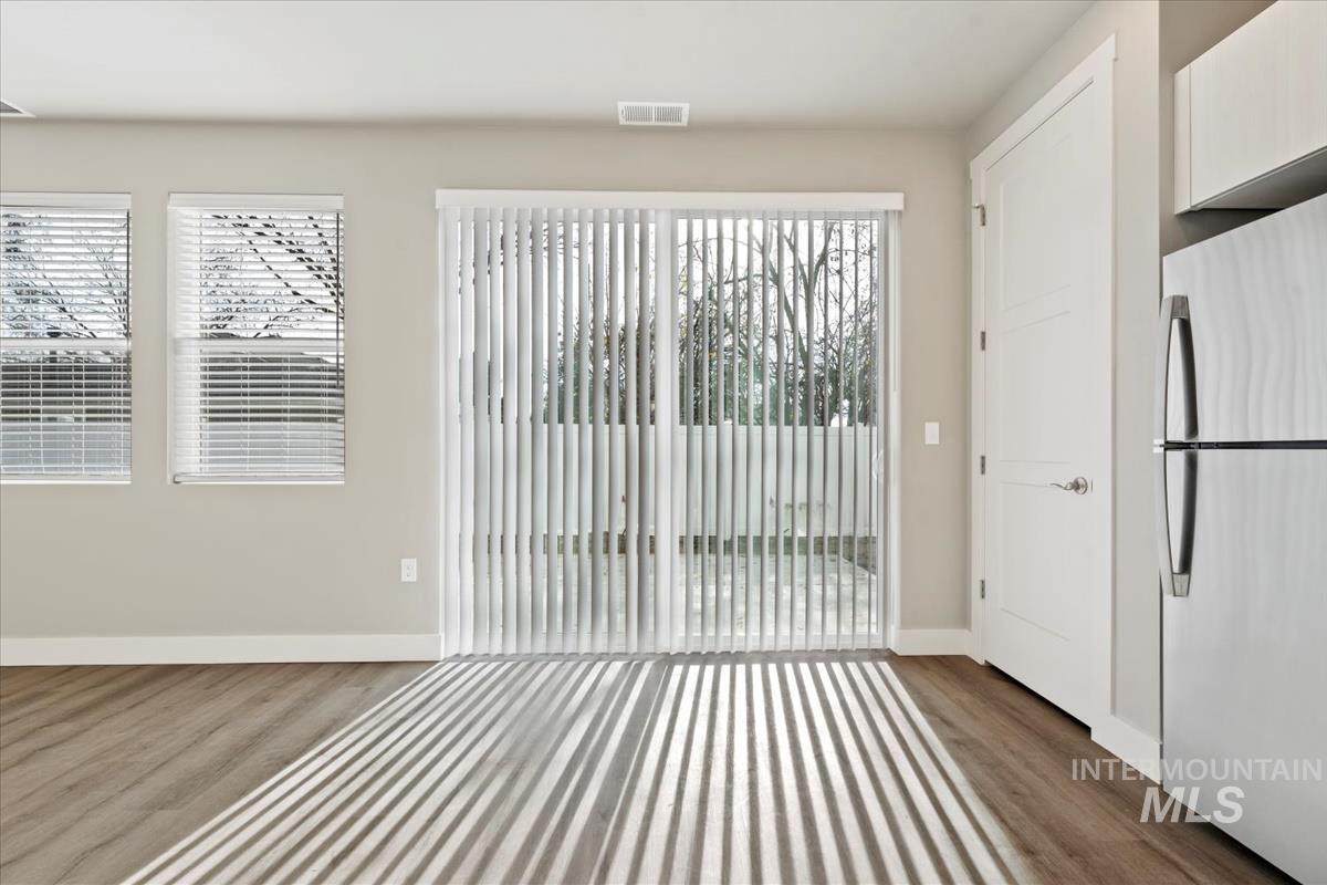 2791 West Palouse Street Boise, ID 83705 - Photo 6 of 26 Interior space featuring wood finished floors and plenty of natural light