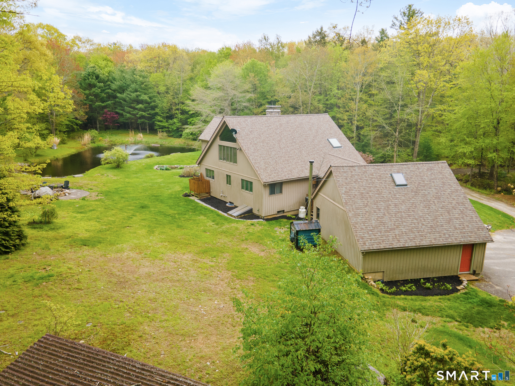 72 Wild Cat Hill Road Harwinton, CT 06791 - Photo 29 of 40 a view of a house with a yard