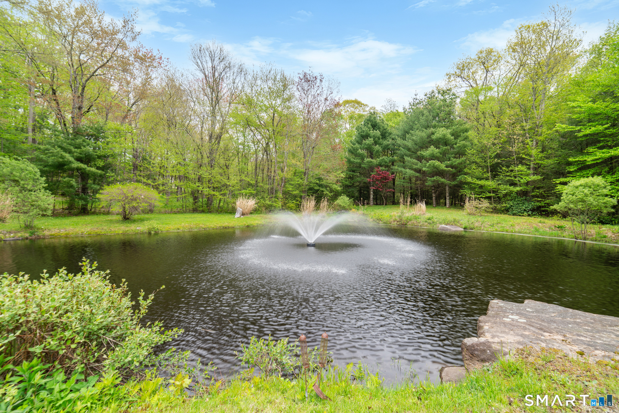 72 Wild Cat Hill Road Harwinton, CT 06791 - Photo 30 of 40 a view of a lake with a yard