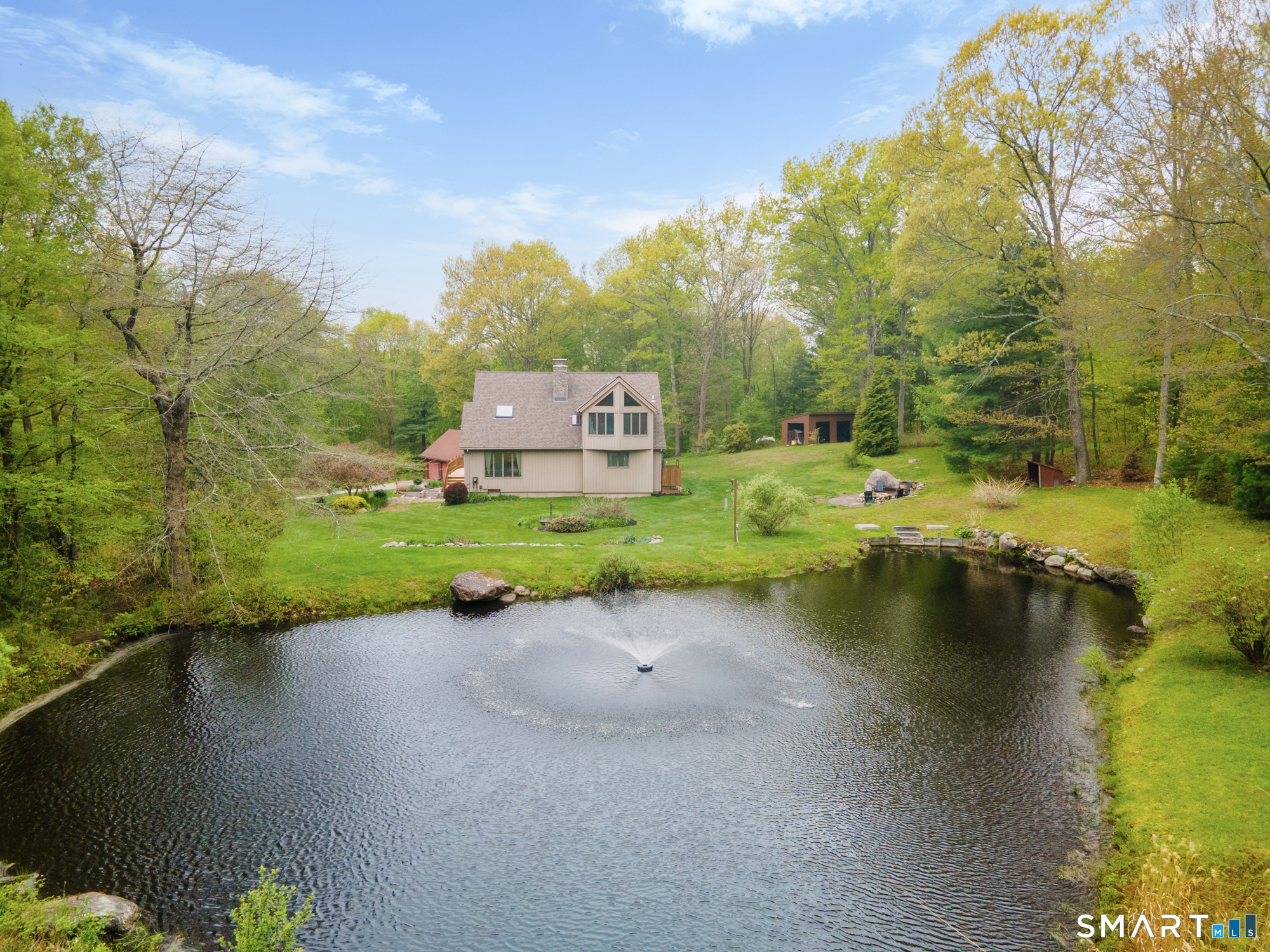 72 Wild Cat Hill Road Harwinton, CT 06791 - Photo 31 of 40 a view of a lake with houses
